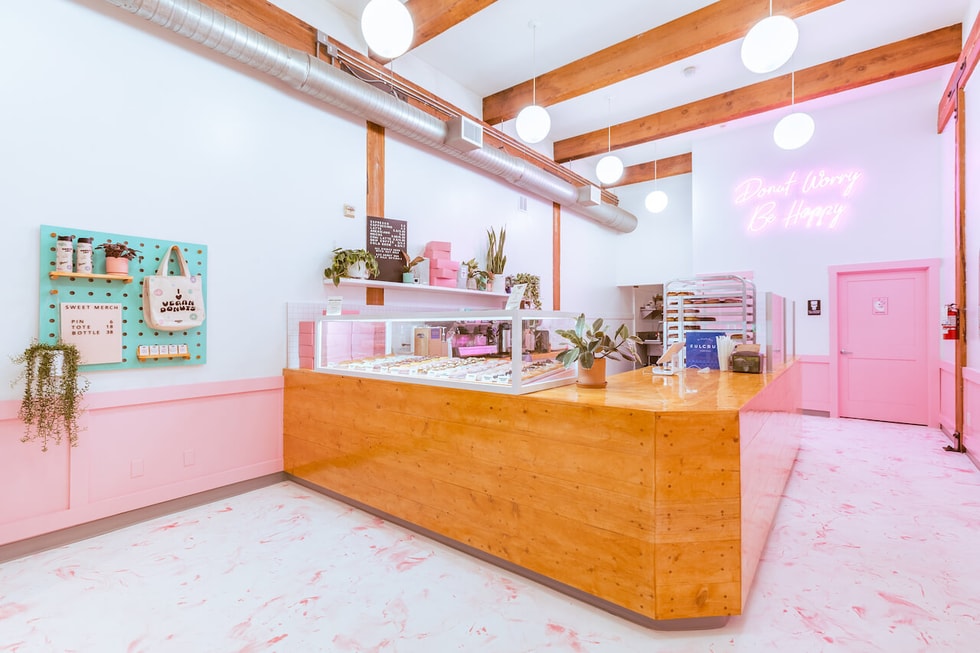 A pink and white metallic epoxy floor in a vegan donut shop.  