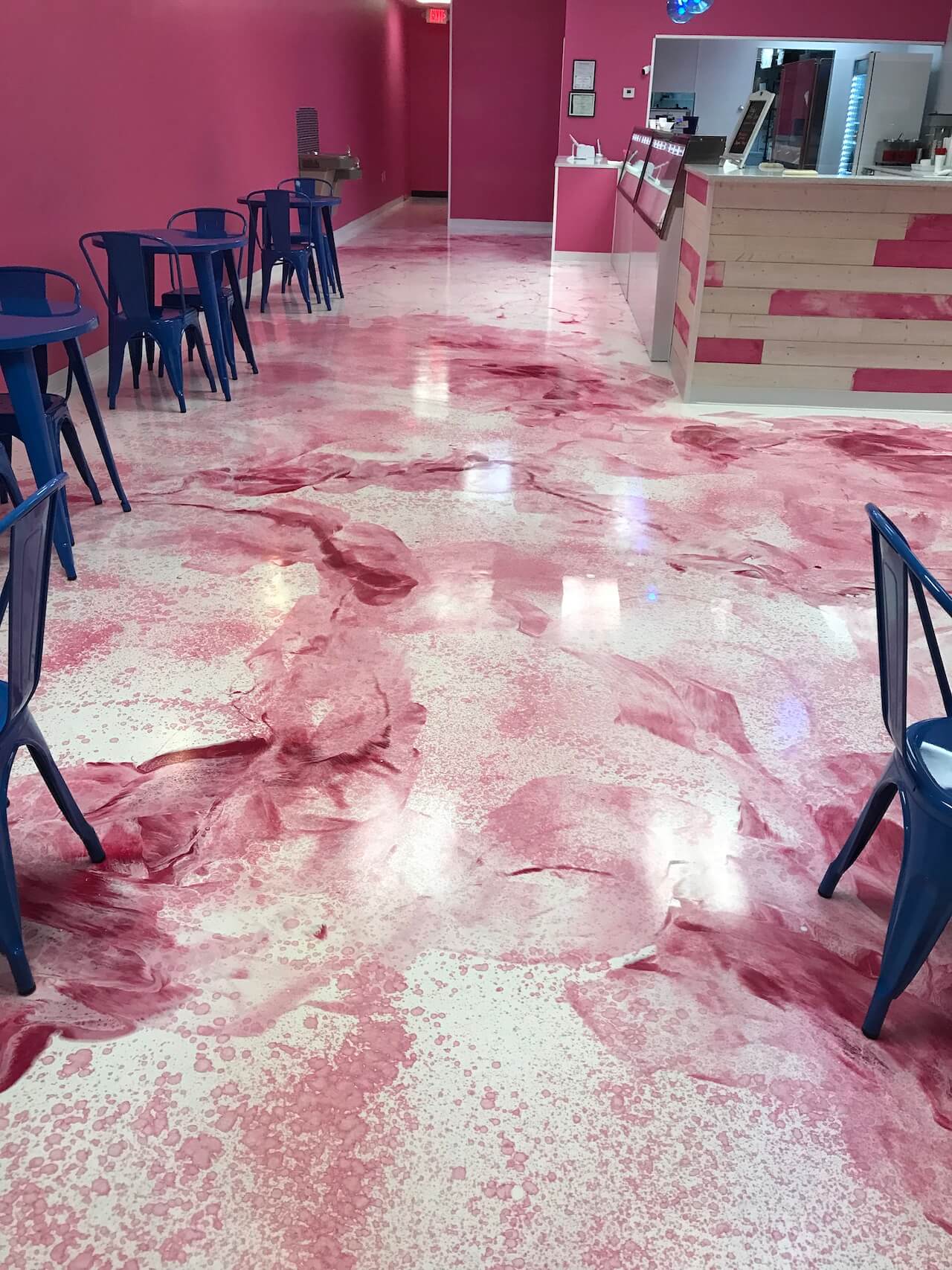 A beautiful pink, red, and white epoxy floor installed in fun and modern dessert restaurant.