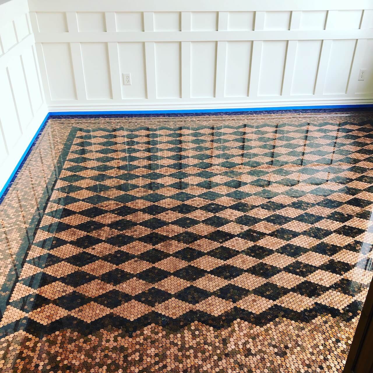 Beautiful checkerboard pattern created with light and dark pennies and then flooded with Leggari's clear epoxy.