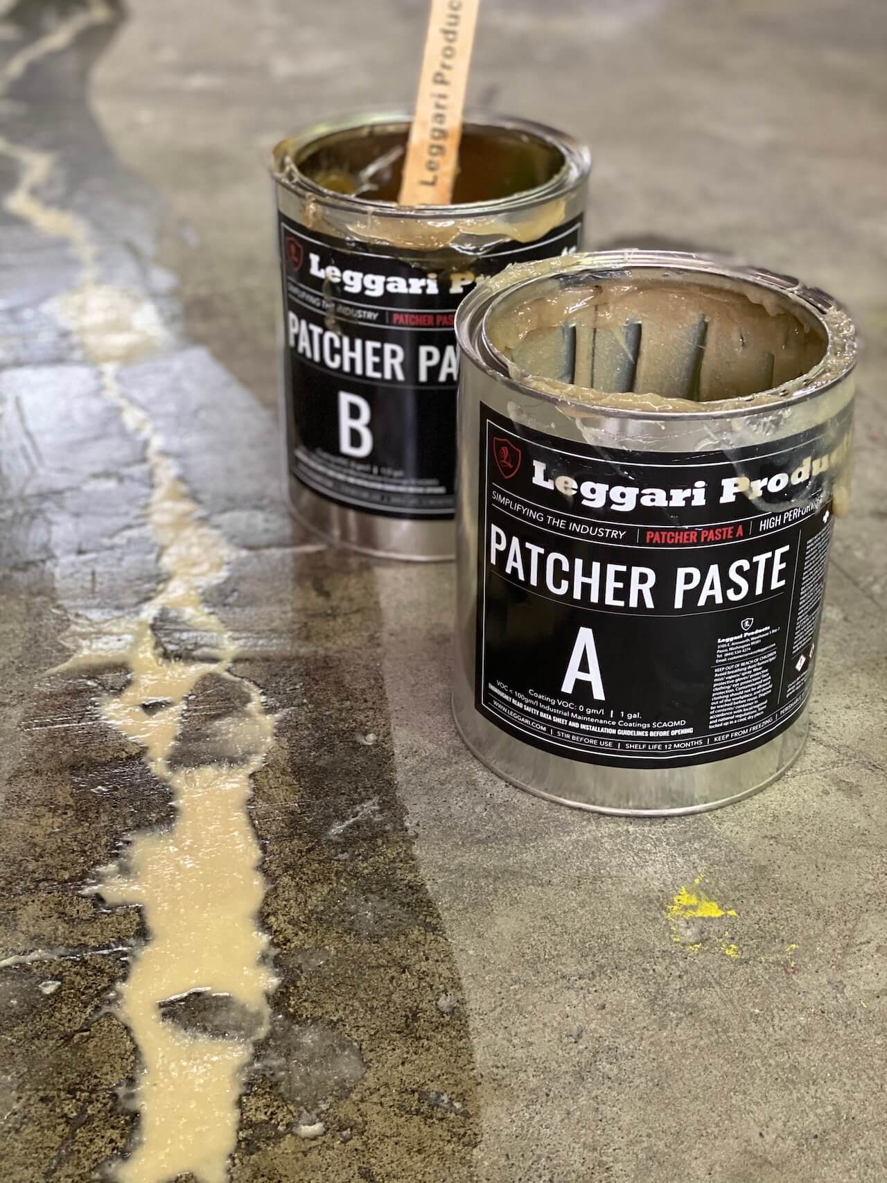 Leggari patcher paste applied to cracks in a concrete floor prior to installing metallic epoxy.
